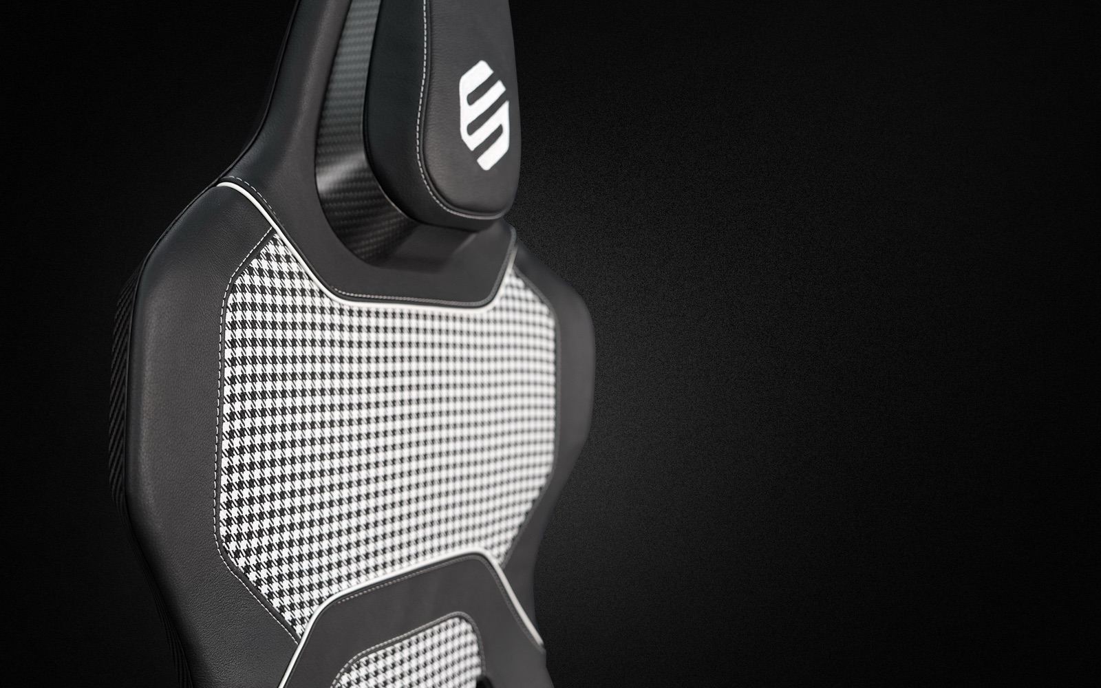 Upper backrest showing carbon fibre, houndstooth insert and embossed Fiberseats emblem